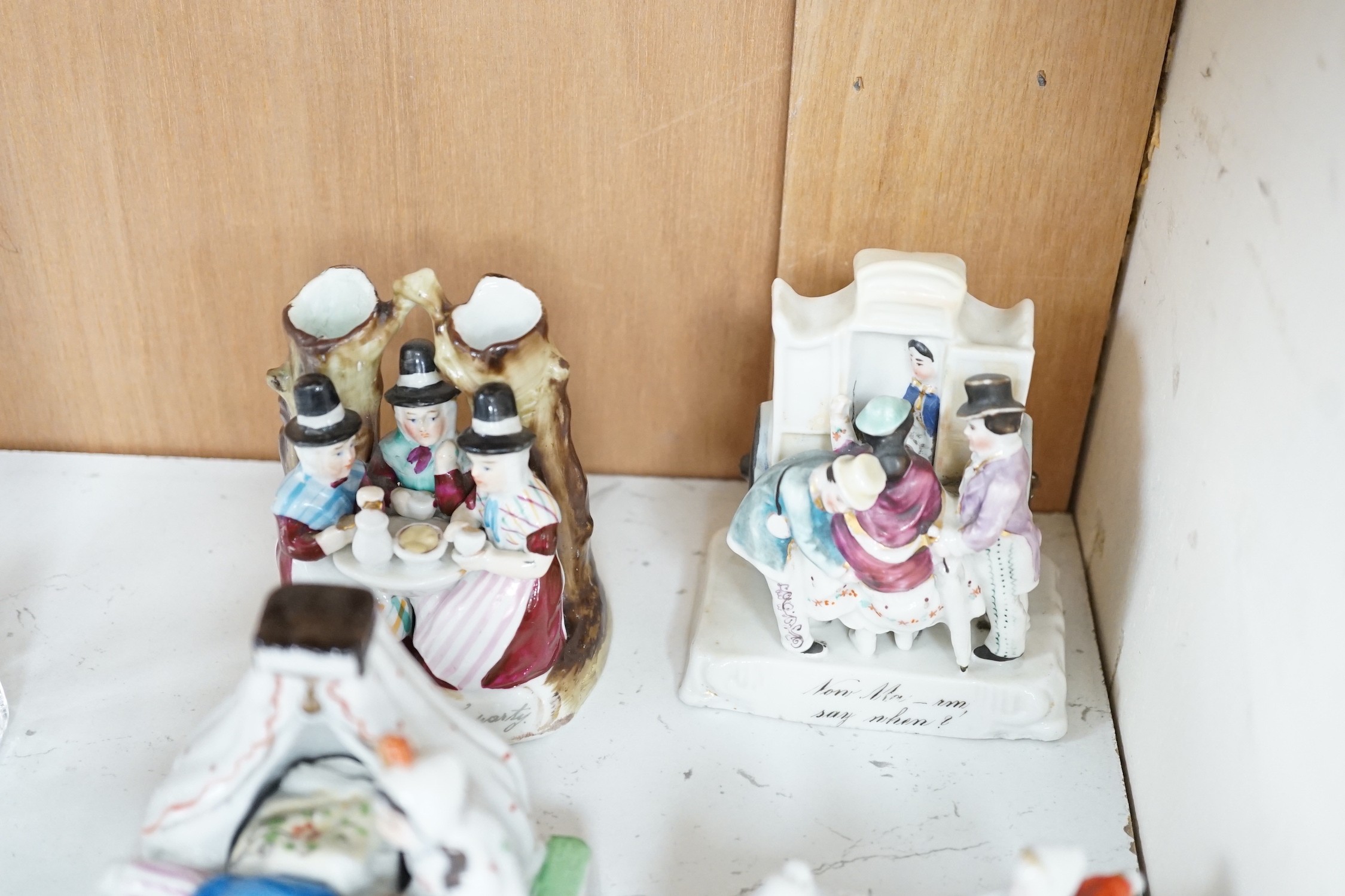 A collection of 14 German porcelain Fairings and a related book - Antiques collectors guide by Derek H. Jordan